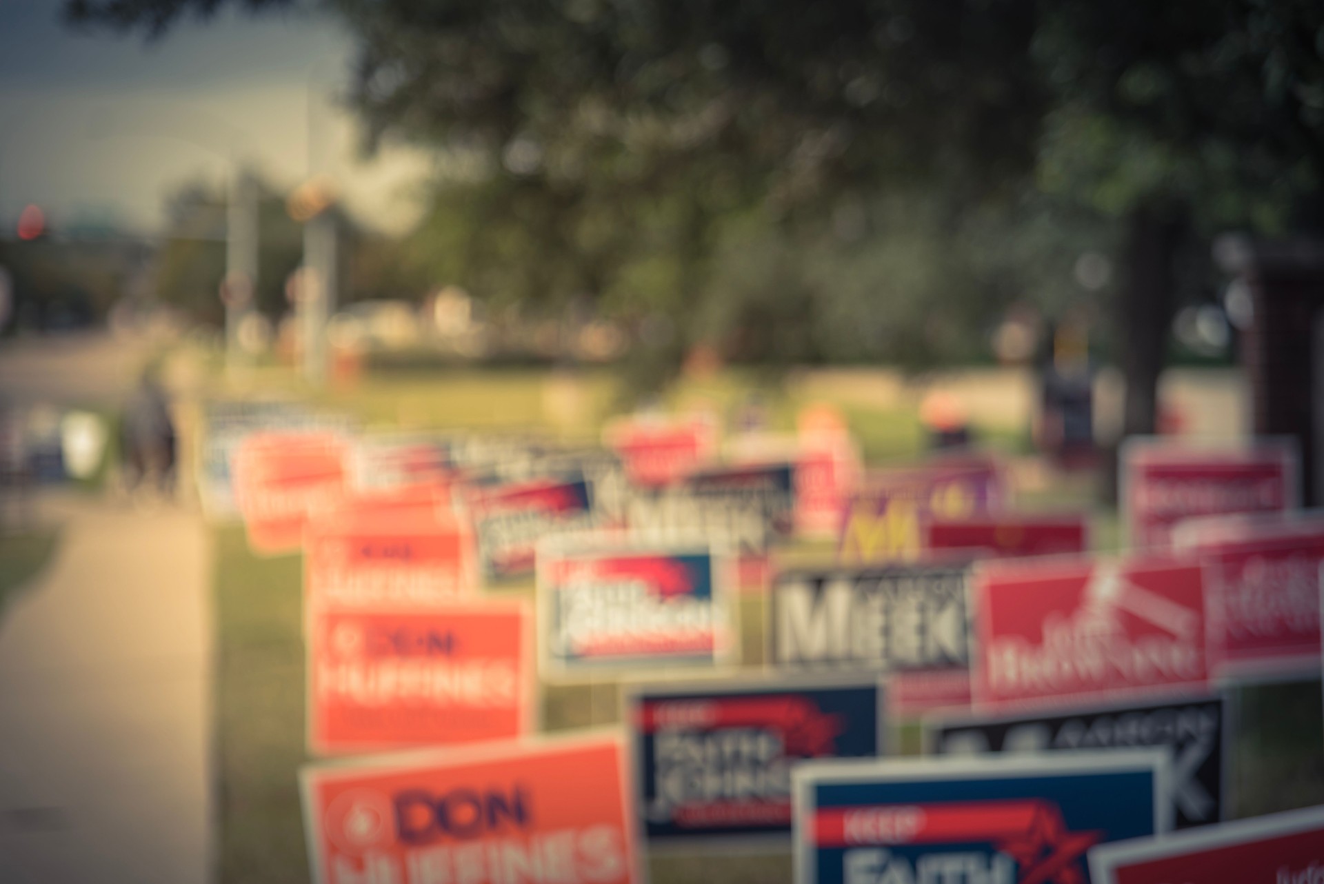 Filtered tone blurry background dense of yard signs for primary, midterm election in USA Filtered tone blurry background dense of yard signs for primary, midterm election in USA